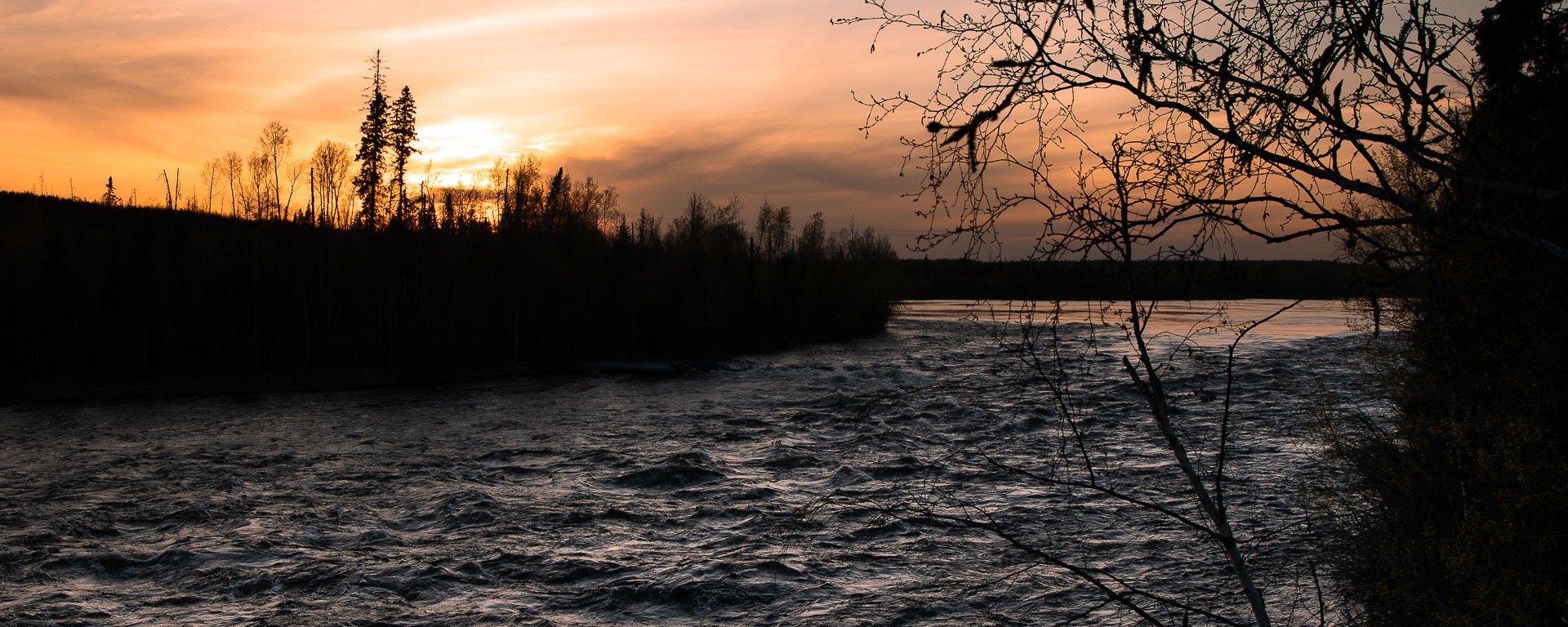 Fast moving river at sunset.