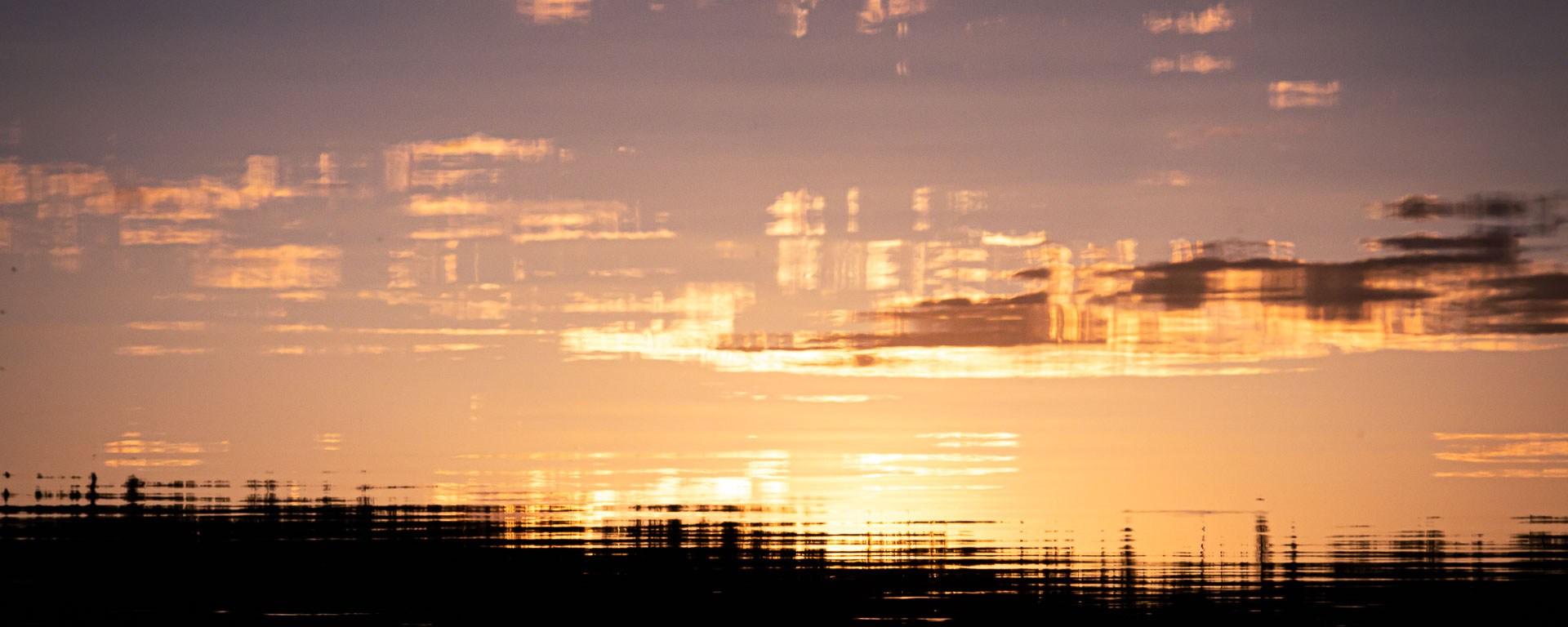 Sunset reflected on lightly rippling waters