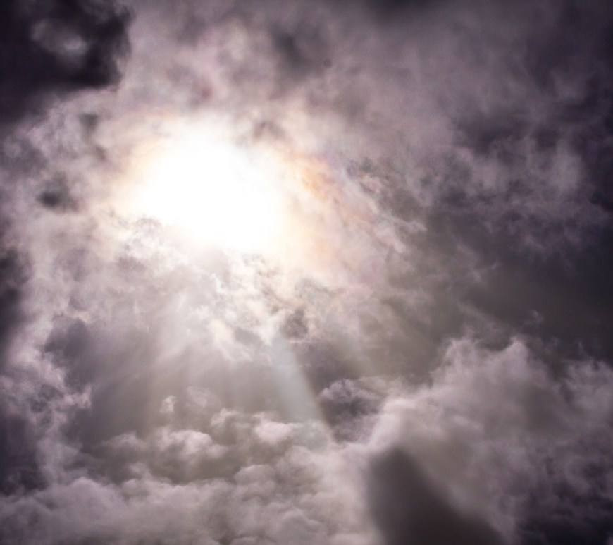 Sun light beams through thick clouds.