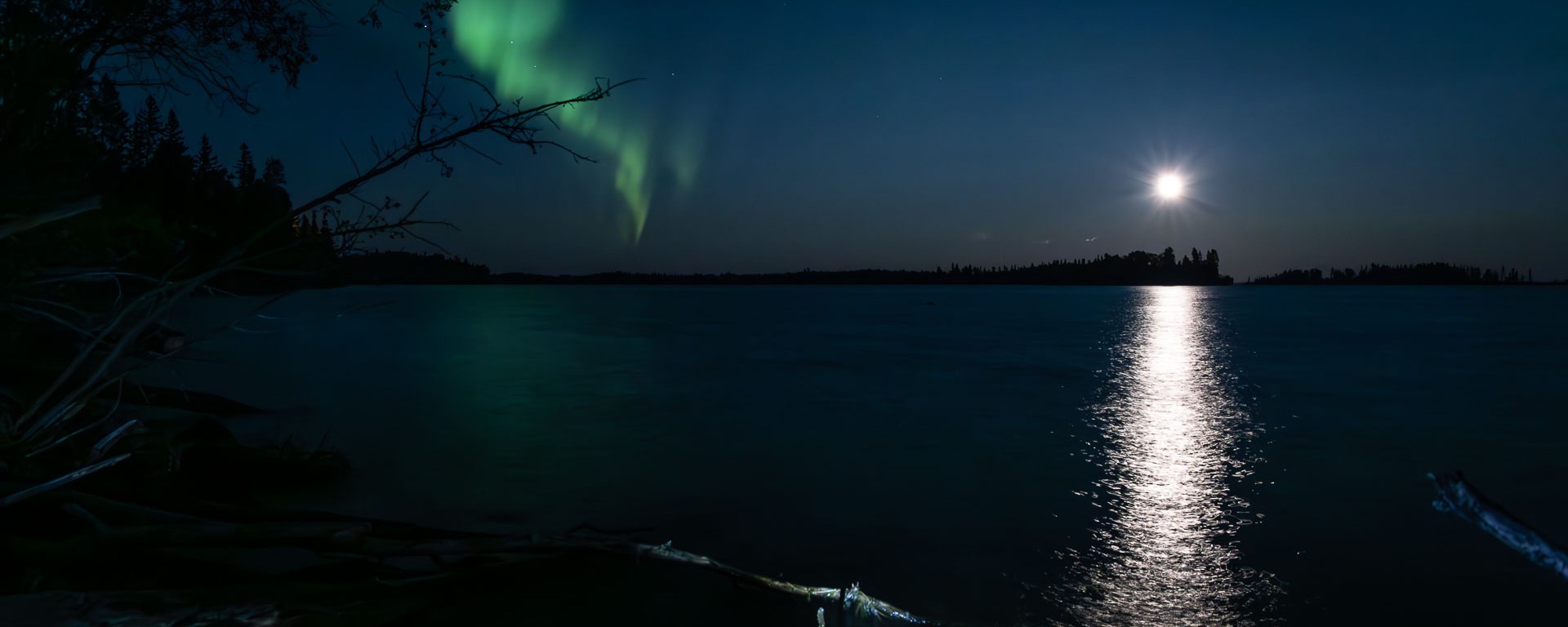The north star shines over a lake