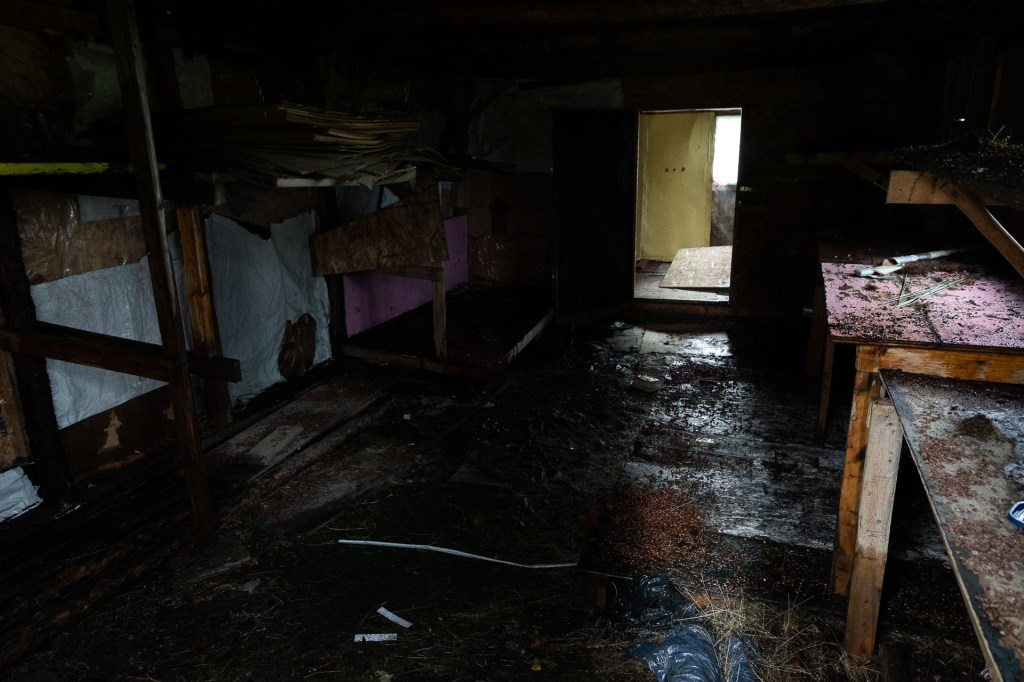 A dark room leading to a bright yellow one