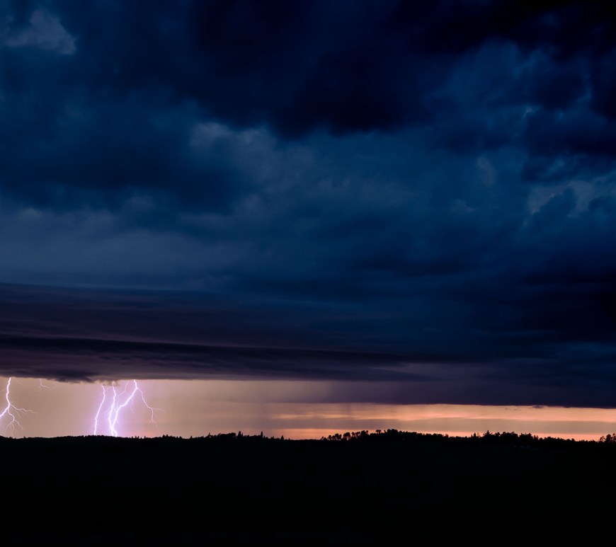 Lightning flashes down in a storm.